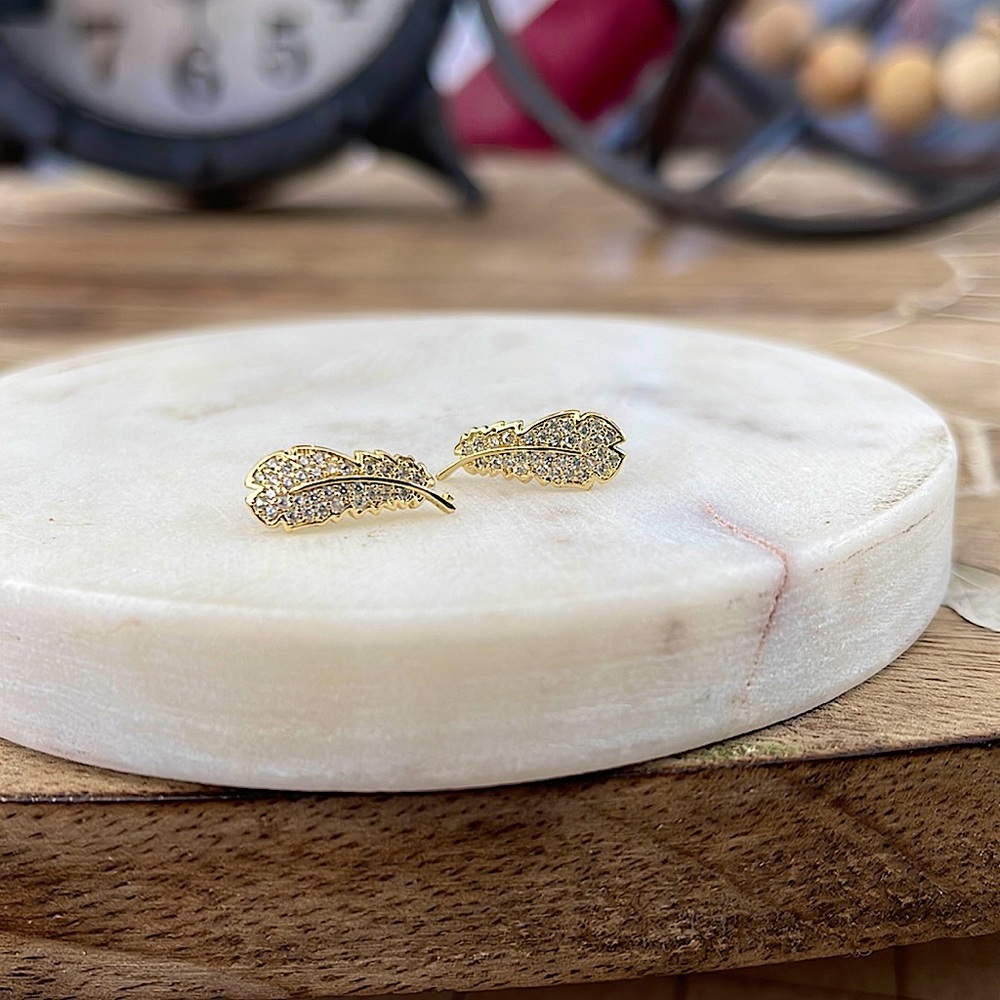 Gold feather stud earrings